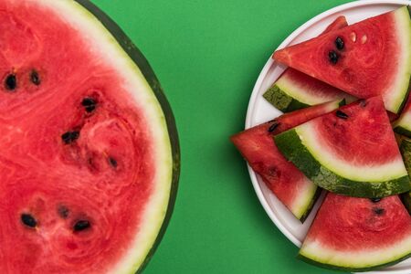 Sliced and Whole Watermelon Half, Flat Lay on Pastel Background.の写真素材