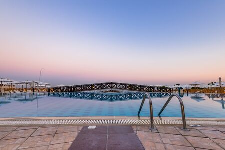 Entrance to Swiming Pool at Hotel Resort, Sunrise Blue Hour, Rhode, Greece.の写真素材