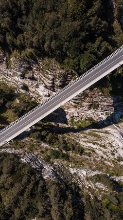 Road Bridge Over Valley, Mangart, Slovenia. Aerial Top Down Drone View.の写真素材
