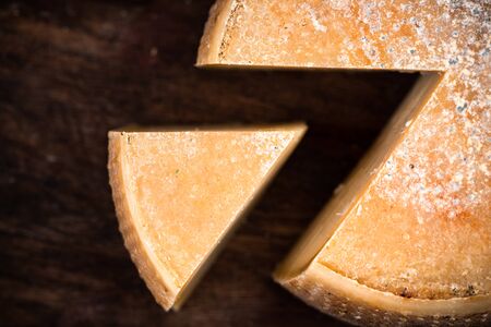 Hard Matured Cheese Wheel. Local Traditional Food Production in Diary Cellar.の写真素材