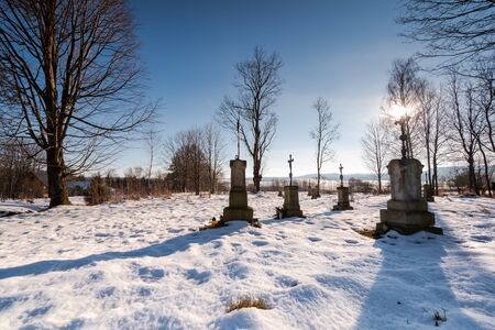 Small Cemetary in Bieszczady Village Bystre at Winter Time Covered in Snow.の写真素材