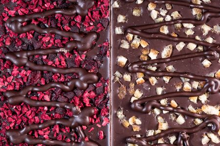 Chocolate Bars Topped with Freeze - Dried Fruits. Top Down Closeup View.