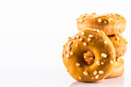 Salted Caramel Donut or Doughnuts on White Reflective Background with Copy Space.の写真素材
