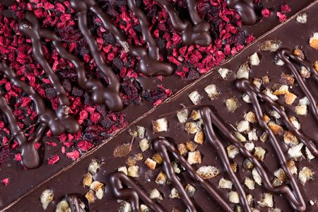 Chocolate Bars Topped with Freeze - Dried Fruits. Top Down Closeup View.の写真素材