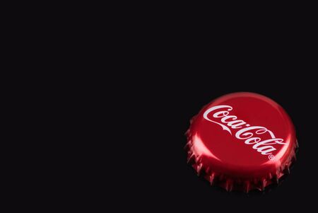 TARNOW, POLAND - FEBRUARY 01, 2020: Classic Red Coca-Cola Bottle Cap. Cocal-Cola is One of the Most Popular Refreshing Drinks.のeditorial素材
