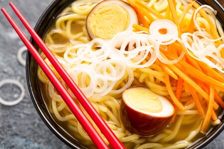 Ramen Soup with Marinated Egg Served with noodles and Fresh Vegetables.の写真素材