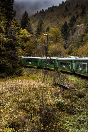 Retro Train Journey Trough Bieszczady Mountains in Poland. Autum Season. Moody and Toned Image.