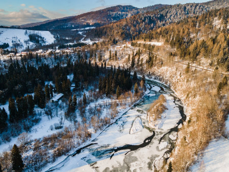 Ice Covered Frozen San River in Bieszczady Mountains Park in Poland at Winter Season.の写真素材