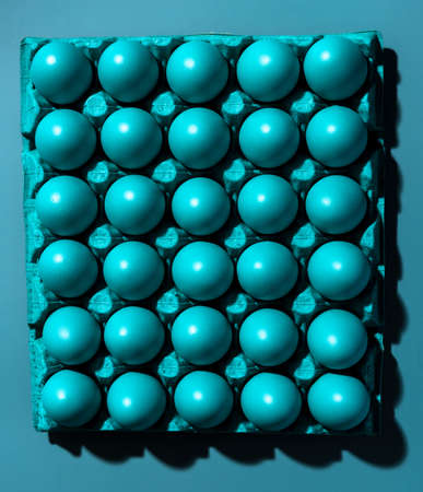 Blue PAstel Eggs Background. Creative Abstract Image with Harsh Flash Light .