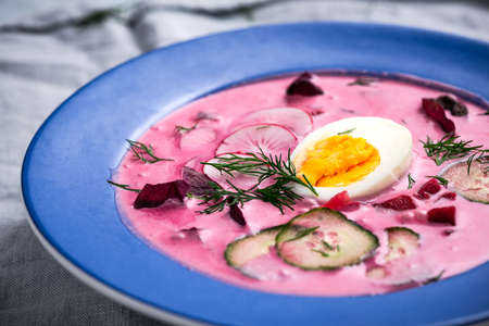 Borscht Traditional Polish Cold Beet Soup Chlodnik with Fresh Vegetables and Egg.