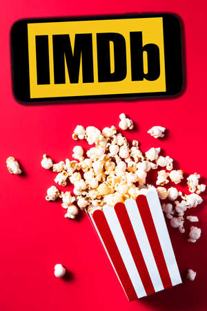 TARNOW, POLAND â APRIL 2021: IMDb on smartphone display screen. MDb is an online database of information related to films, television programs, home videos and streaming content online.のeditorial素材