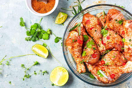 Chicken Legs Drumstick Preparation for BBQ Grill. Marinating Food in SPices.