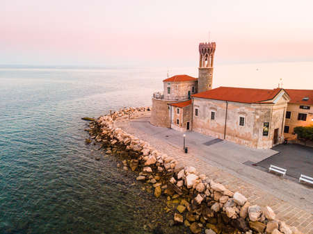 Lighthouse in Piran Slovenia. Aerial Drone View at Sunrise.の写真素材