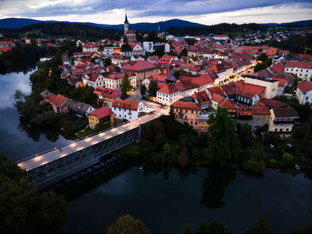 Evening Cityscape of Novo Mesto in Lover Carniola Region in Slovenia at River Krka Bend. Drone View.