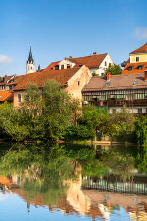 Novo Mesto Old Town Houses Reflection in Krka River, Slovenia.の写真素材
