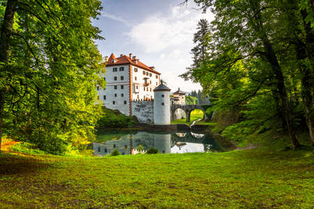 Sneznik Castle in Slovenia. Picturesque Flowing Castle Reflection in Pond.のeditorial素材