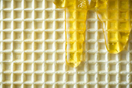 Honey Glaze on Waffel. Close Up View. Food Background.の写真素材
