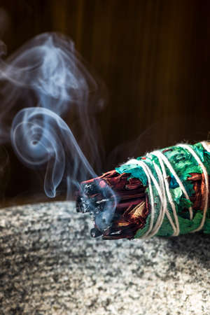 Smudge Ritual Burning Sage Stick. Spiritual Meditation and Yoga Ritual.の写真素材