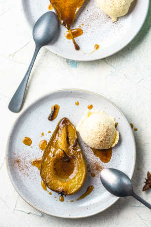Ripe Pear Poached and Baked in Caramel and Spices. Dessert Serving Portion.の写真素材