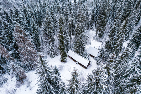 Winter Wonderland with Snow and Wooden Houses in Mountains.