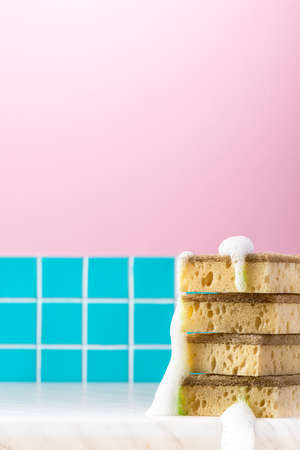 Eco firendly bamboo kitchen sponge in table. Copy space background.