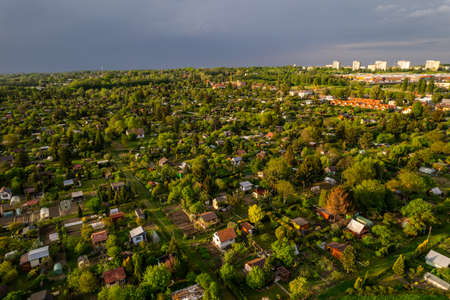 Colorful Small Plot Garden in Urban Area of Tarnow, Poland. Summer Lush Foliage. Drone Top Down View..の写真素材