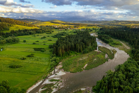 Bialka River in Podhale region, High tatras mountains in Poland at sunset. Drone Viewの写真素材