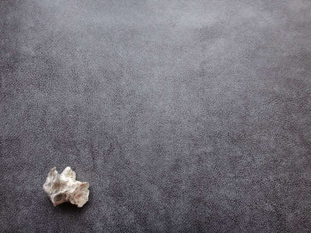 rock on gray textured backgroundの写真素材