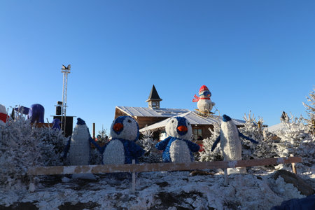 Snowman at the ski resort in the winter on a sunny dayの写真素材