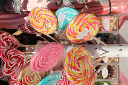 Colorful lollipops on a stick in a shop window