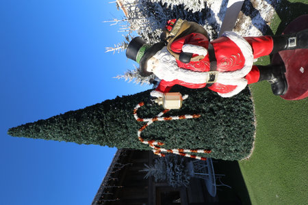santa claus on the christmas tree in front of blue skyの写真素材