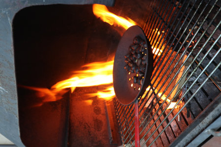 Fire and smoke in an iron brazier, close-upの写真素材