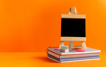 Essential supplies to have for a good return to school, to the institute. It is presented on an orange background.の写真素材
