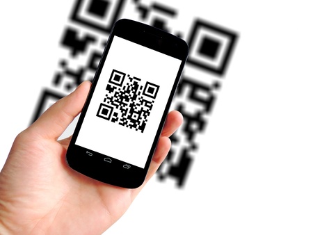 hand is scanning QR code with mobile phone