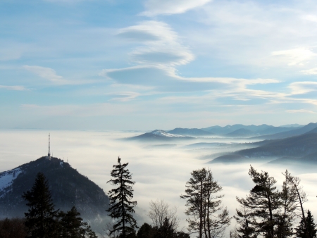 fog in mountains landscape in sunny dayの写真素材