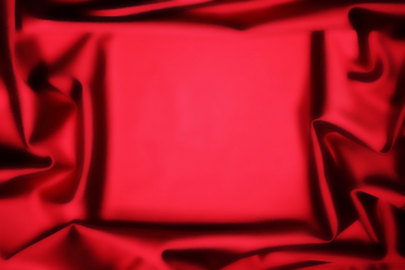 soft red silk fabric frame in middle backgroundの写真素材