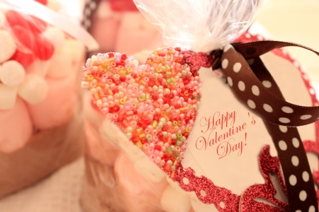 bags of red and pink sweets and candiesの写真素材