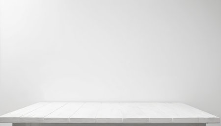 Empty white wooden table over white wall background, product display montageの素材