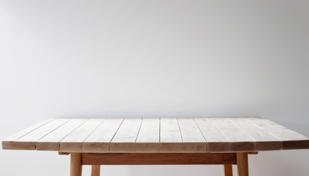 Wooden table top on white wall background with copy space for your textの素材