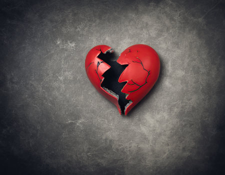 Broken heart on concrete background. Concept of divorce and breakup.の素材