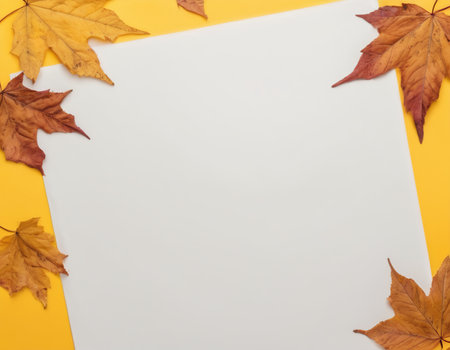 Autumn composition. Frame made of autumn leaves on yellow background. Flat lay, top view, copy spaceの素材