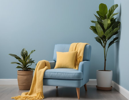 Blue armchair with yellow cushions in front of a blue wallの素材