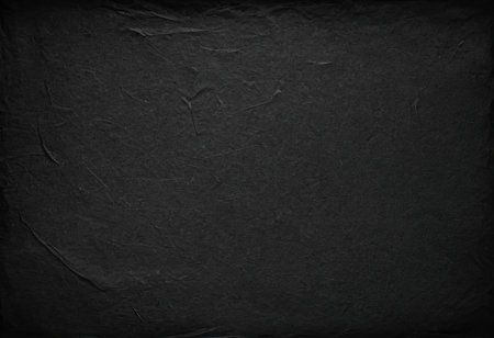 Black paper texture background for design with copy space for text or image.の素材