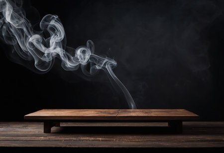 Wooden table and smoke on black background. Mockup for designの素材