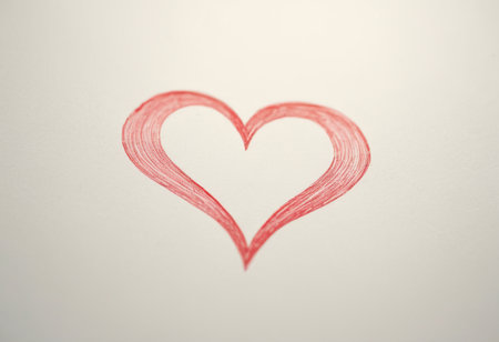 Red heart on white paper background. Valentine's day card. Toned.の素材