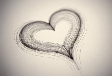 Heart made of hair on a white background. Sepia toned.の素材