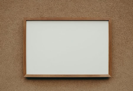 Blank picture frame on brown wall background. Copy space for text.の素材