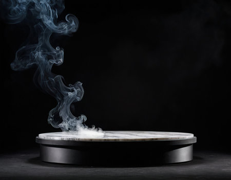 Round podium with smoke on black background. Mockup for design.の素材
