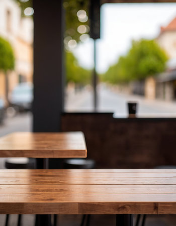 Empty wooden table and coffee shop blur background with bokeh image.の素材