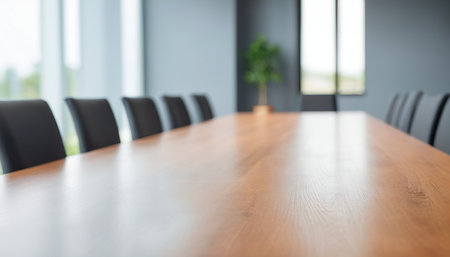 Wooden table and chairs in a meeting room, blur background.の素材